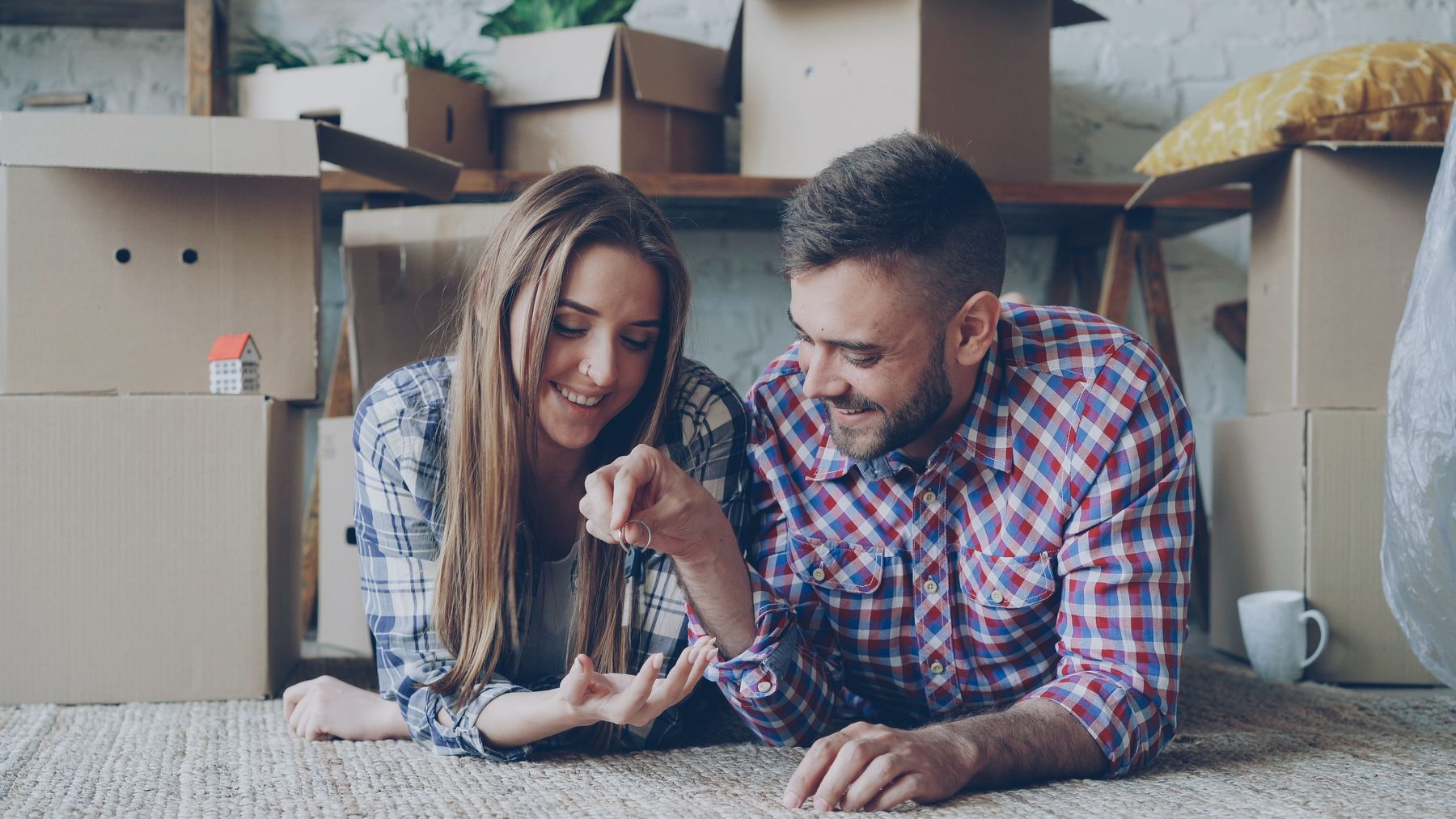 Couple celebrating a move into a new home