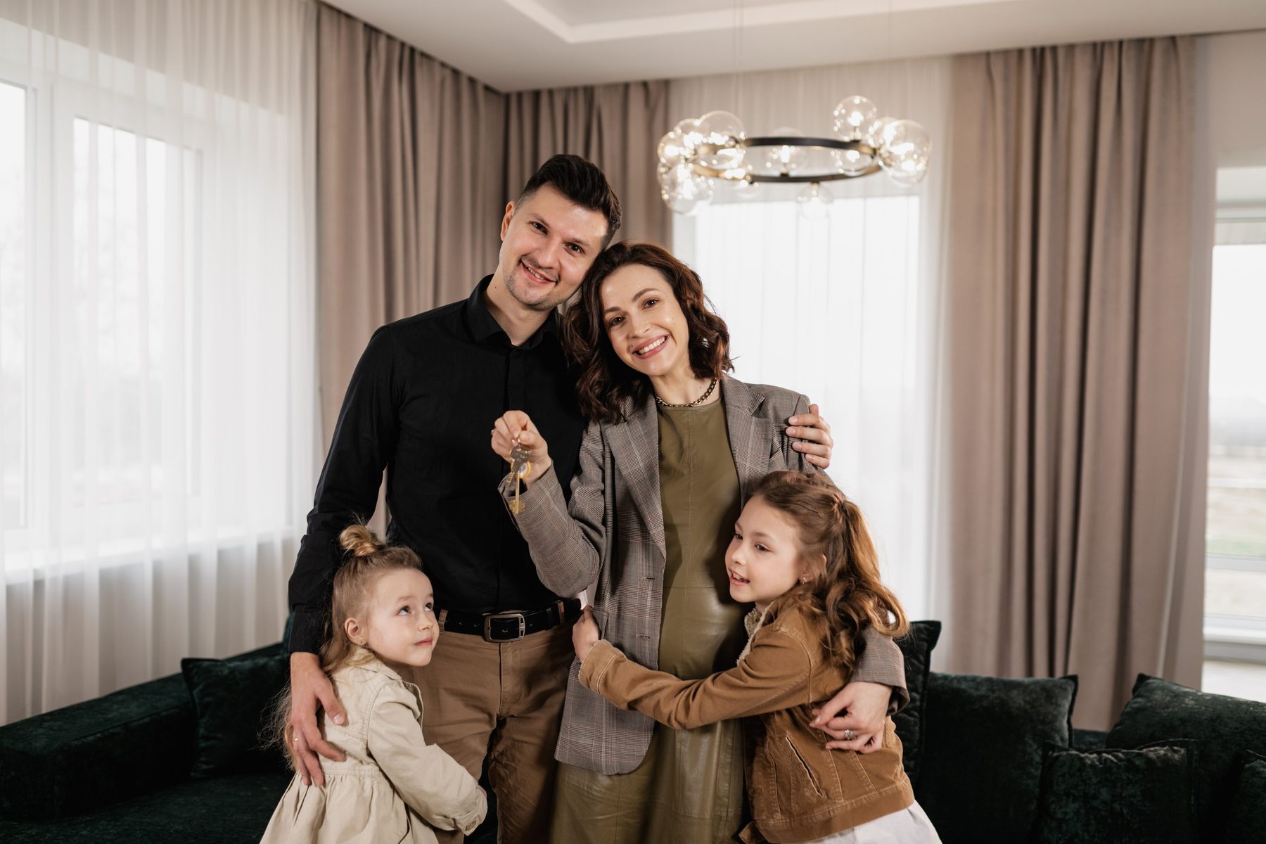 Family celebrating homeownership in a new home