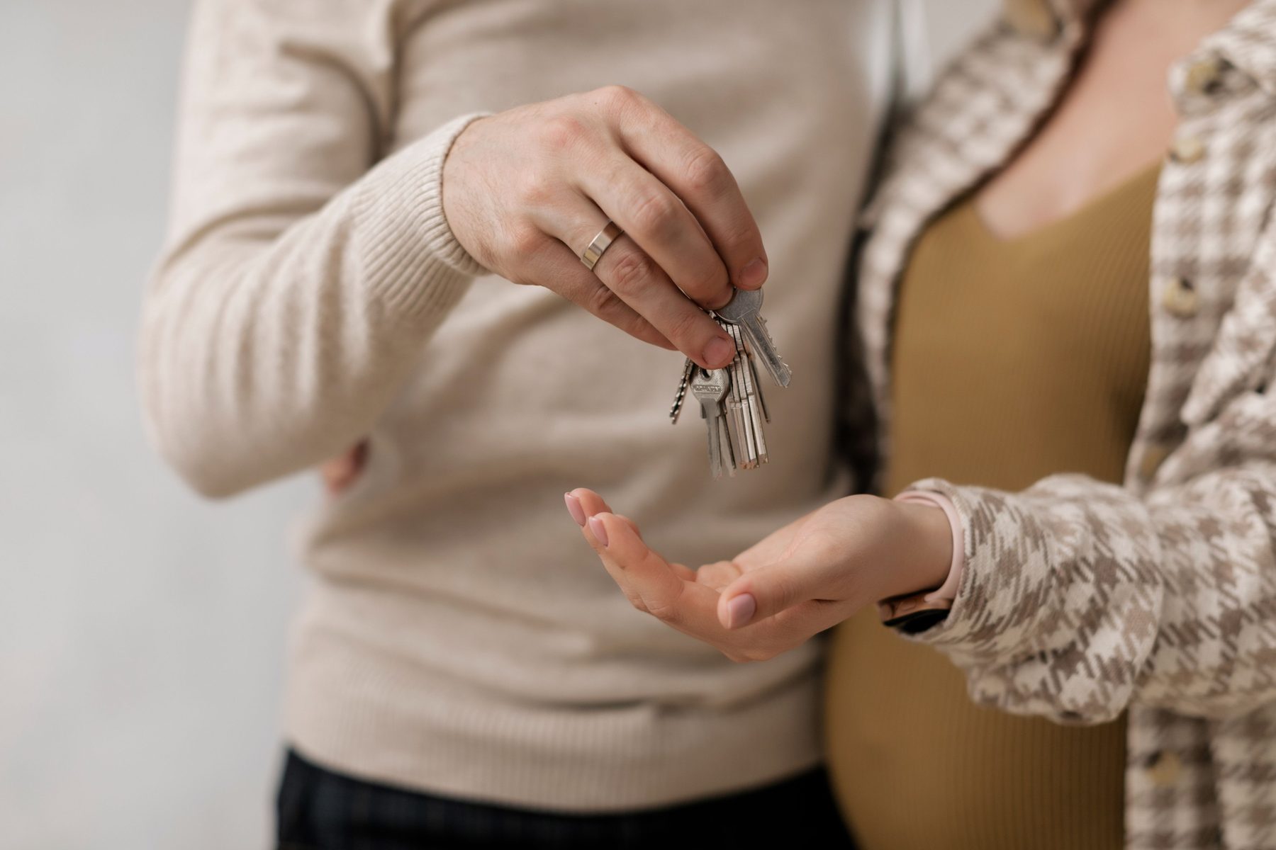 Couple holding keys to a new home